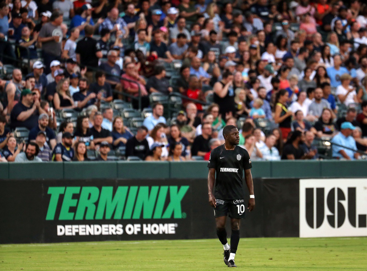 <strong>Memphis 901 FC midfielder Kadeem Dacres (10) plays in front of the first packed house in more than a year during the team's home opener against Atlanta United 2 June 16, 2021.</strong> (Patrick Lantrip/Daily Memphian)