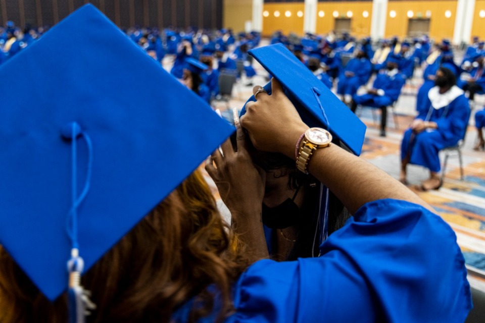 <strong>&nbsp;Graduates prepare before the start of the Watkins Overton High School Commencement at the Renasant Convention Center on Wednesday.</strong> (Brad Vest/Special to The Daily Memphian)