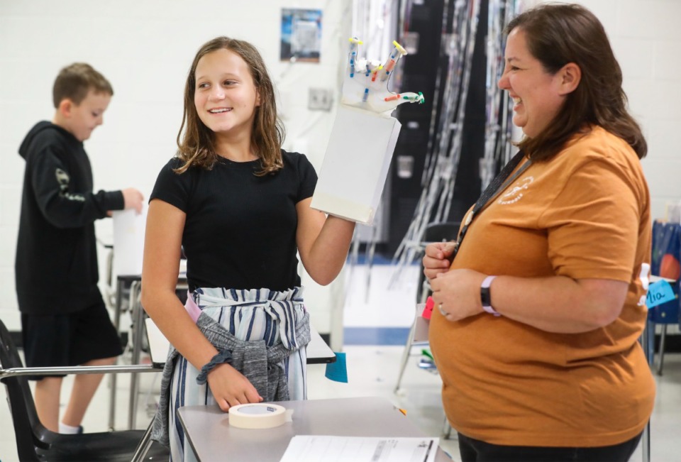 <strong>Arlington Middle School student Ava McGraw (left) shows her &ldquo;Iron Man&rdquo; hand to STEM teacher Andrea Ogle during a learning-loss camp class on Thursday, June 17, 2021. Students made the hands to demonstrate how muscles and tendons work.</strong>&nbsp;(Mark Weber/The Daily Memphian)