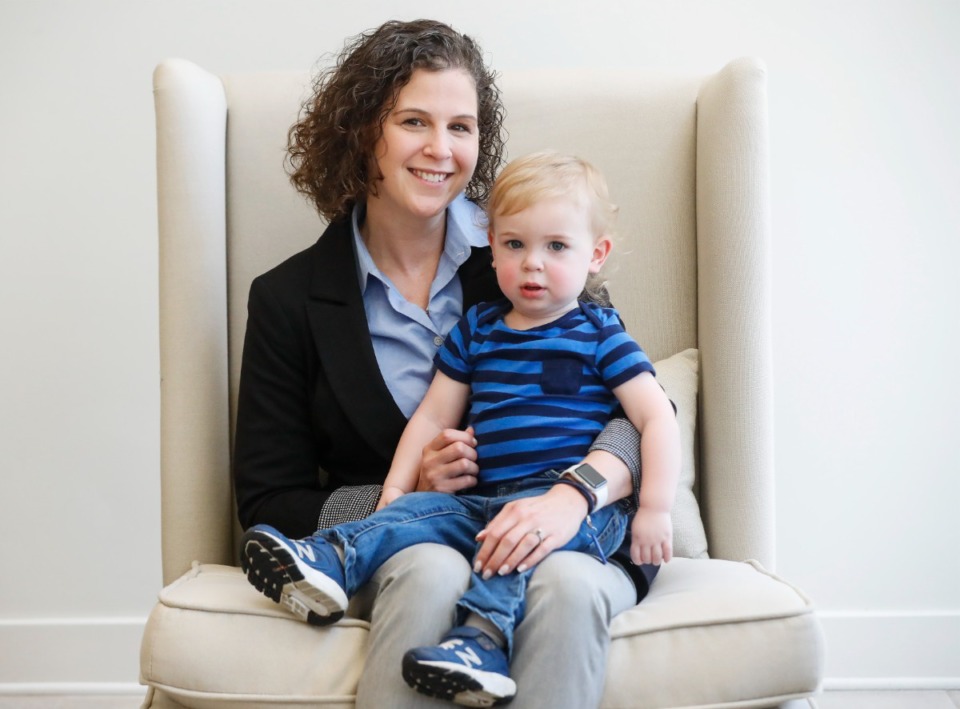 <strong>Abby Wilson sits with her 18-month-old son Johnny in the lobby of her new employer Shoemaker Financial. She left her job managing a small law office to become a financial adviser, a position affording schedule flexibility as her son grows.</strong>&nbsp;(Mark Weber/Daily Memphian)