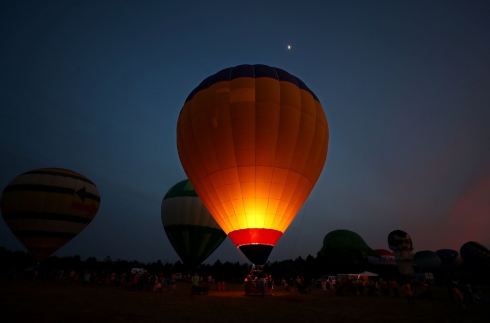 <strong>Hot air balloons light up the sky during the first day of the Bluff City Balloon Jamboree in Collierville on June 18, 2021.</strong> (Patrick Lantrip/Daily Memphian)