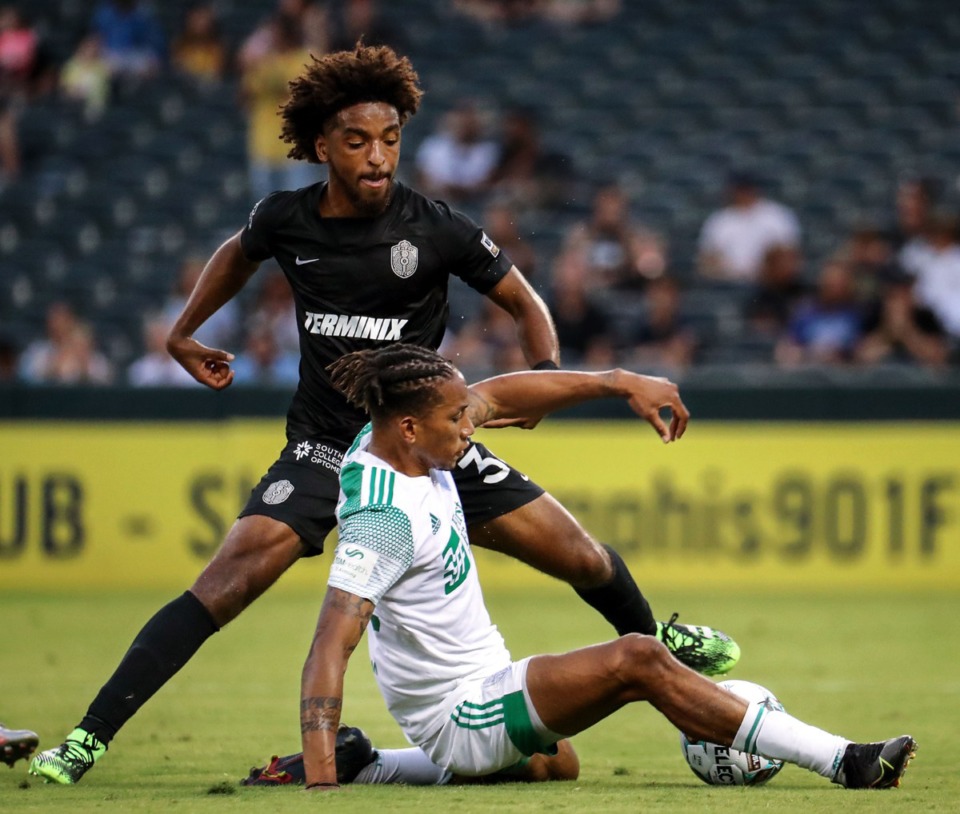 <strong>Memphis 901 FC defender Andre Reynolds (36) stops an OKC Energy forward during a June 19, 2021 home match at AutoZone Park.</strong> (Patrick Lantrip/Daily Memphian)