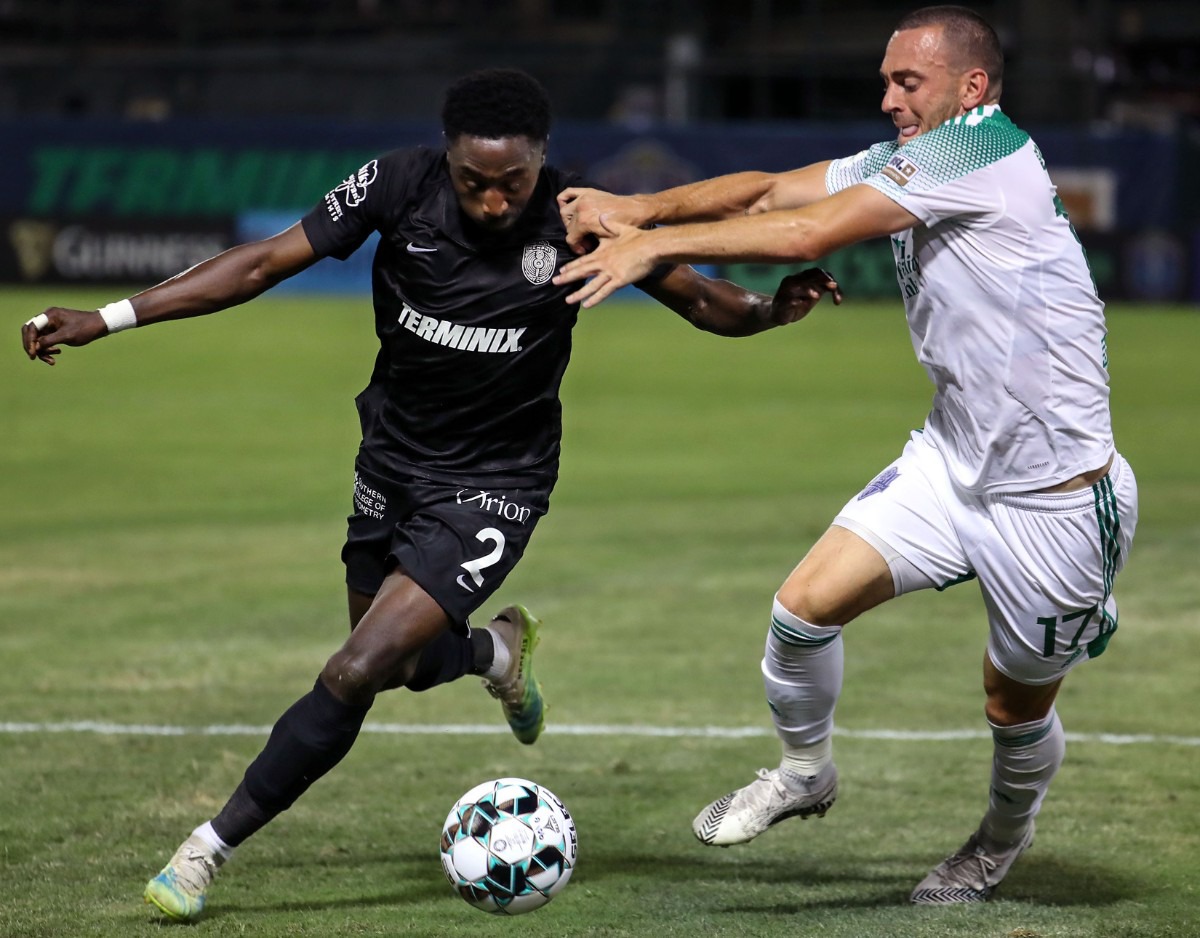 <strong>Memphis 901 FC defender Mark Segbers (2) works to get around OKC Energy FC midfielder Jonathan Brown (17) during a June 19, 2021 match at AutoZone Park.</strong> (Patrick Lantrip/Daily Memphian)