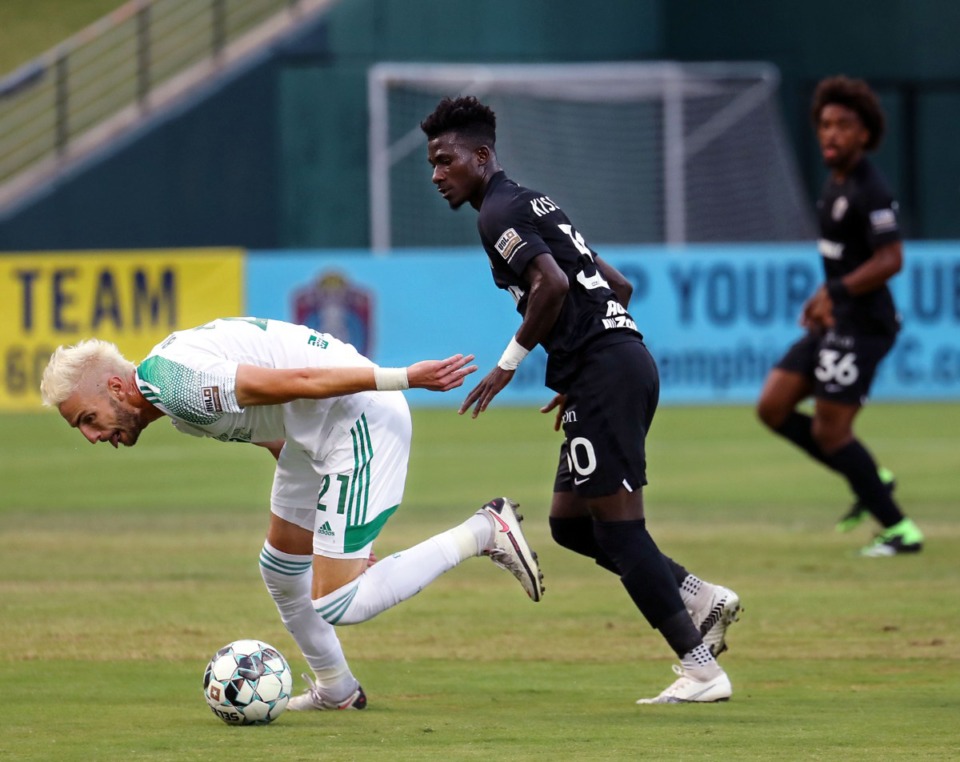 <strong>Memphis 901 FC midfielder Laurent Kissiedou (30) works to get the ball from OKC Energy FC forward Villyan Bijev (21) during a June 19, 2021 match at AutoZone Park.</strong> (Patrick Lantrip/Daily Memphian)