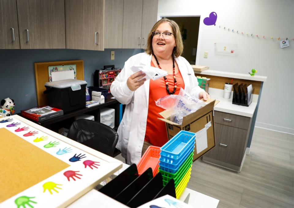 <strong>Dr. Lisa Powell stocks supplies while preparing to open a new pediatric clinic in Arlington next month.</strong> (Mark Weber/The Daily Memphian)