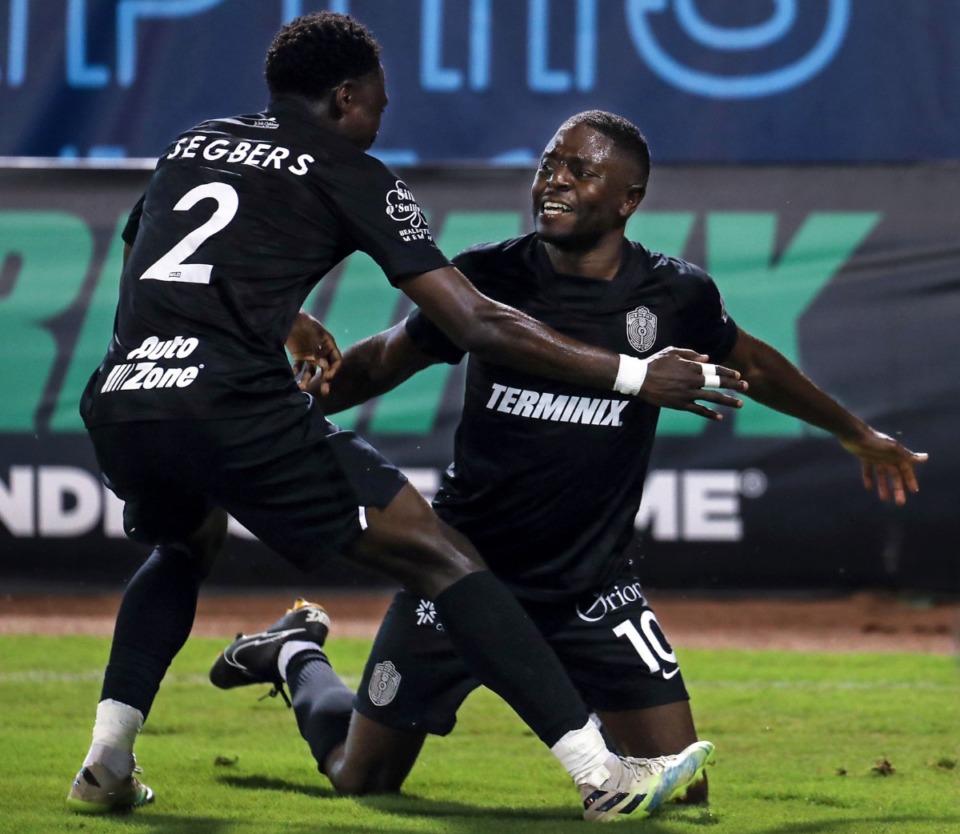 <strong>Memphis 901 FC defender Mark Segbers (2) celebrates with teammate Kadeem Dacres (10) after the latter scored a goal during a June 26, 2021 home game against Sporting KC II.</strong> (Patrick Lantrip/Daily Memphian)