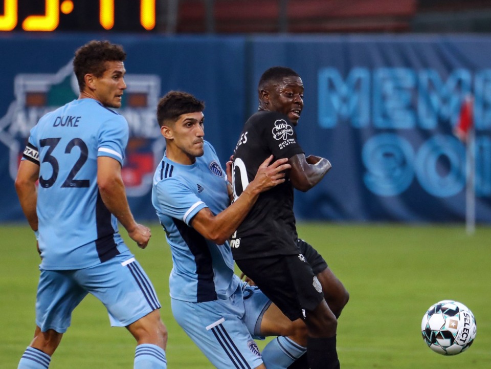 <strong>Memphis 901 FC forward Kadeem Dacres (10) goes for a loose ball during a June 26, 2021 home game against Sporting KC II.</strong> (Patrick Lantrip/Daily Memphian)