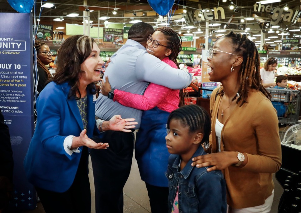 <strong>Kroger associate Christine Porter&nbsp; (middle) is congratulated after winning $1 million in the store&rsquo;s Community Immunity Giveaway on Monday, June 28, in Germantown.&nbsp;Porter is an employee at the Brandon, Mississippi, store, which is part of the grocer&rsquo;s division based in Memphis.</strong> (Mark Weber/Daily Memphian)