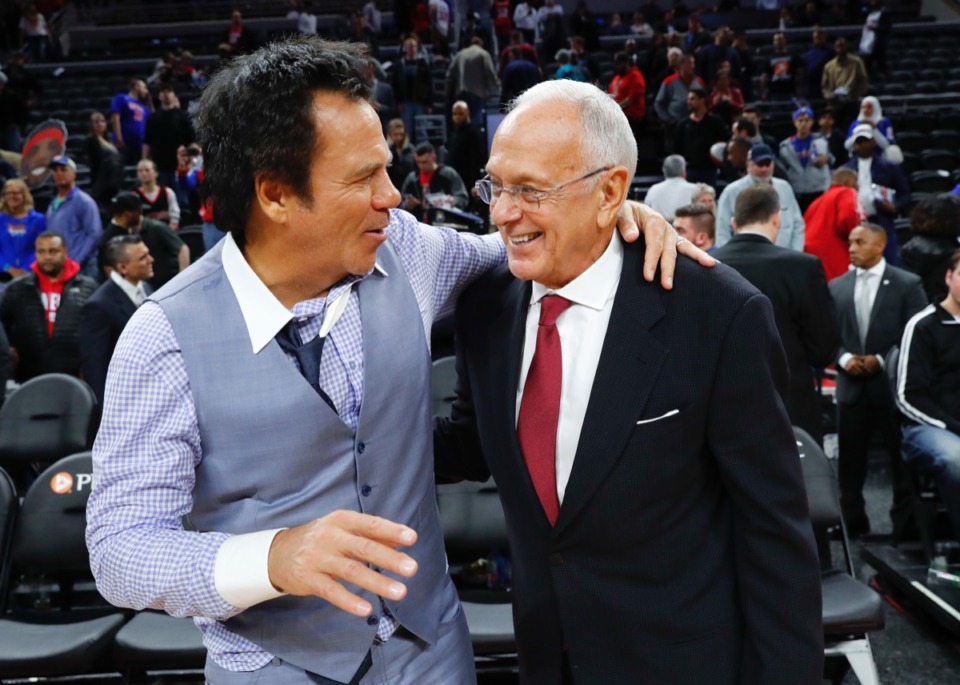 <strong>Former Pistons coach Larry Brown, right, talks with Detroit owner Tom Gores in 2017.&nbsp;Brown has been named coach of the year in the ABA, NBA and NCAA. But he&rsquo;s also left three schools &mdash; UCLA, Kansas and SMU &mdash; with postseason bans.</strong> (Paul Sancya/AP file)