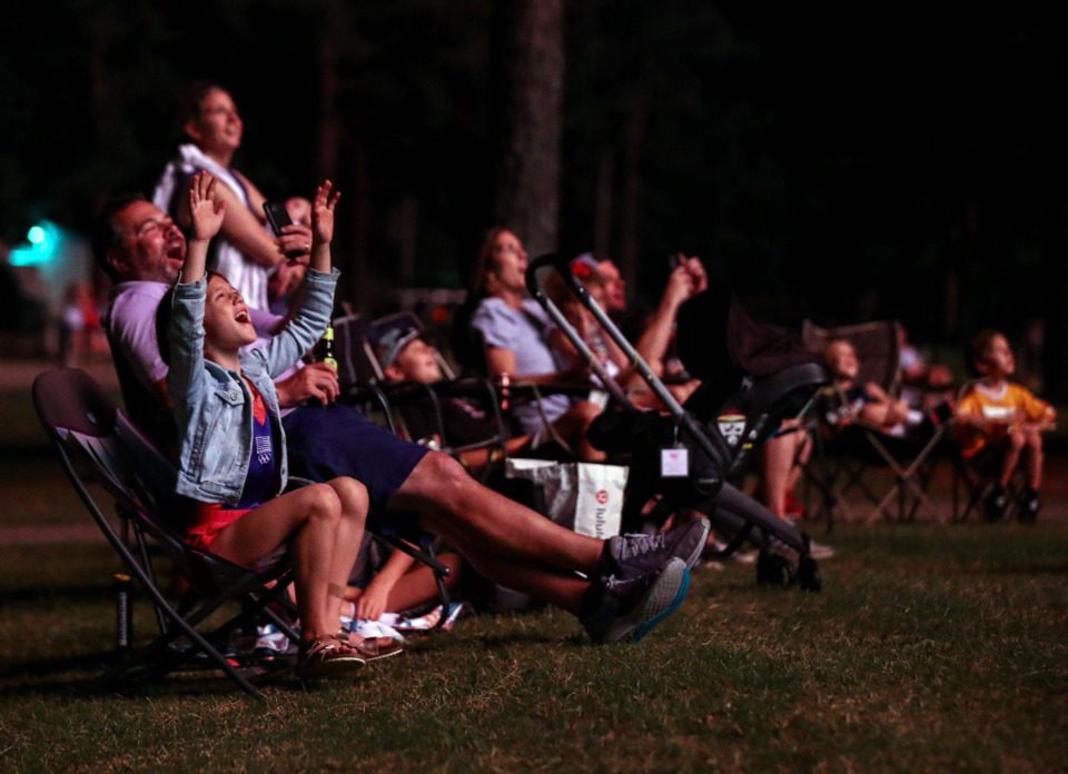 <strong>Nine-year-old Mary Paisley Bingham excitedly watches the finale of the Collierville fireworks show at H.W. Cox Park with her family July 3, 2021.</strong> (Patrick Lantrip/Daily Memphian)