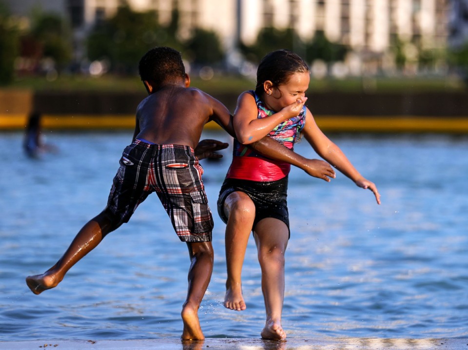 <strong>Kasshios Cooper and Bella Kirk agree to jump into the water together at Mud Island River Park July 4, 2021.</strong> (Patrick Lantrip/Daily Memphian)