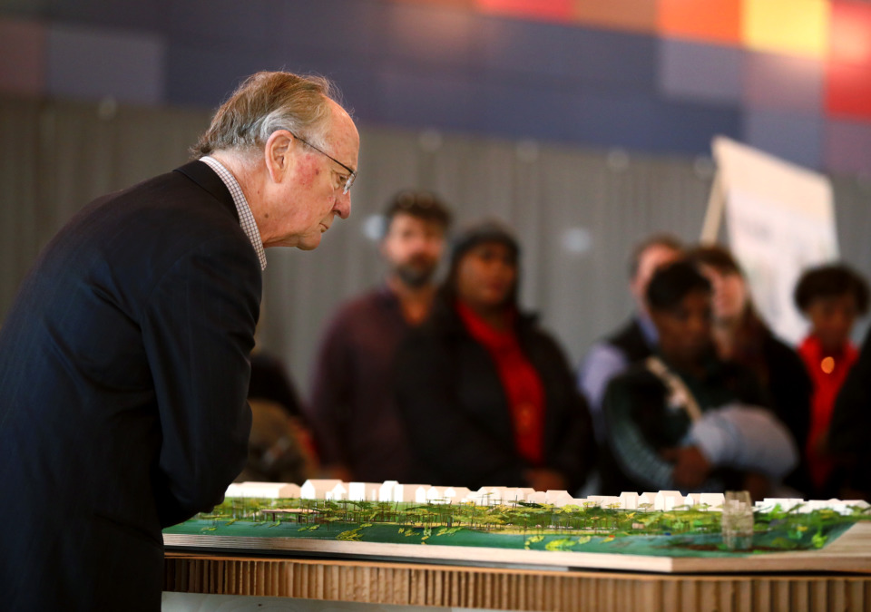 <strong>Henry Turley (left), who is a potential funder for the new design of Tom Lee Park, takes a close look at the to-scale model of the proposed park created by Studio Gang architects. The new design will expand the park to a total of six miles and will include five park districts.</strong> (Houston Cofield/Daily Memphian)