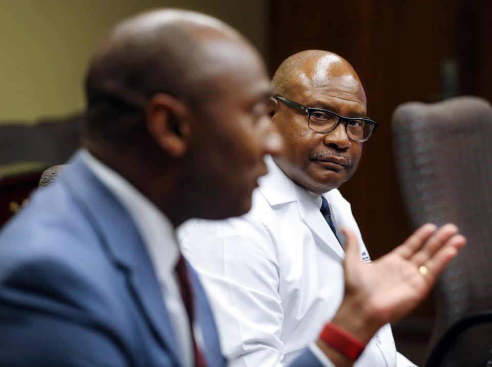 <strong>Dr. Bruce Randolph listens to Shelby County Mayor Lee Harris speak at a July 15, 2021, briefing addressing the surge of Delta variant cases locally.</strong> (Patrick Lantrip/Daily Memphian)