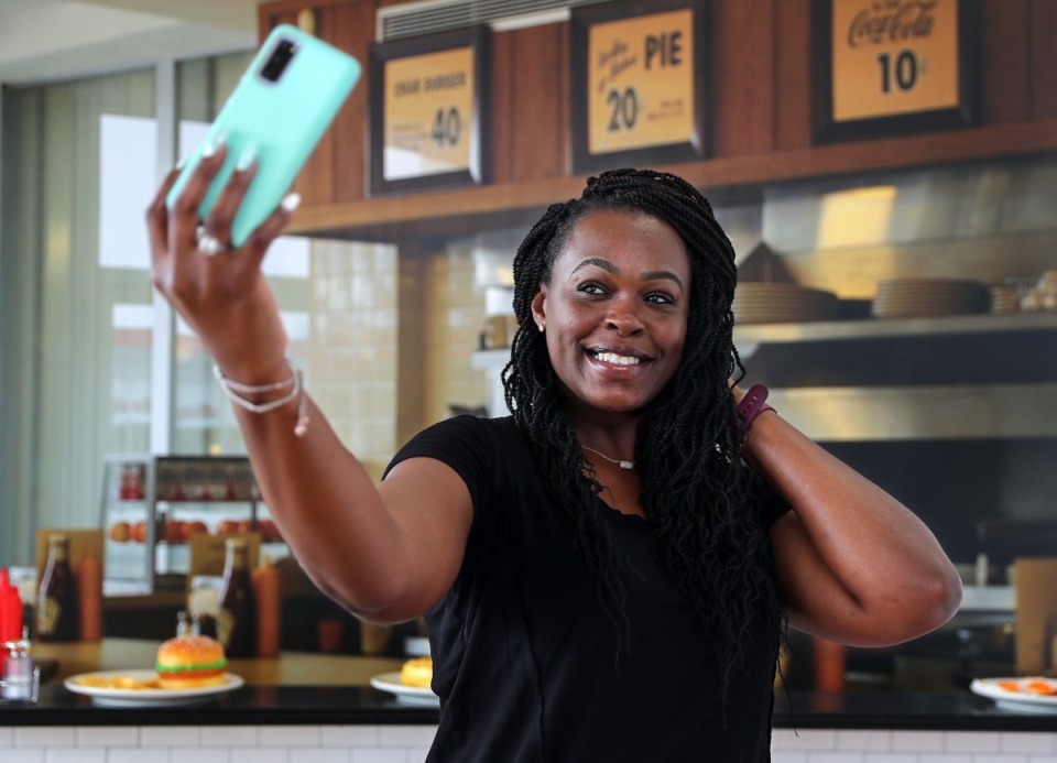 <strong>Kimberly Gaulmon takes a selfie in a booth at Pose 901's grand opening July 22, 2021.</strong> (Patrick Lantrip/Daily Memphian)