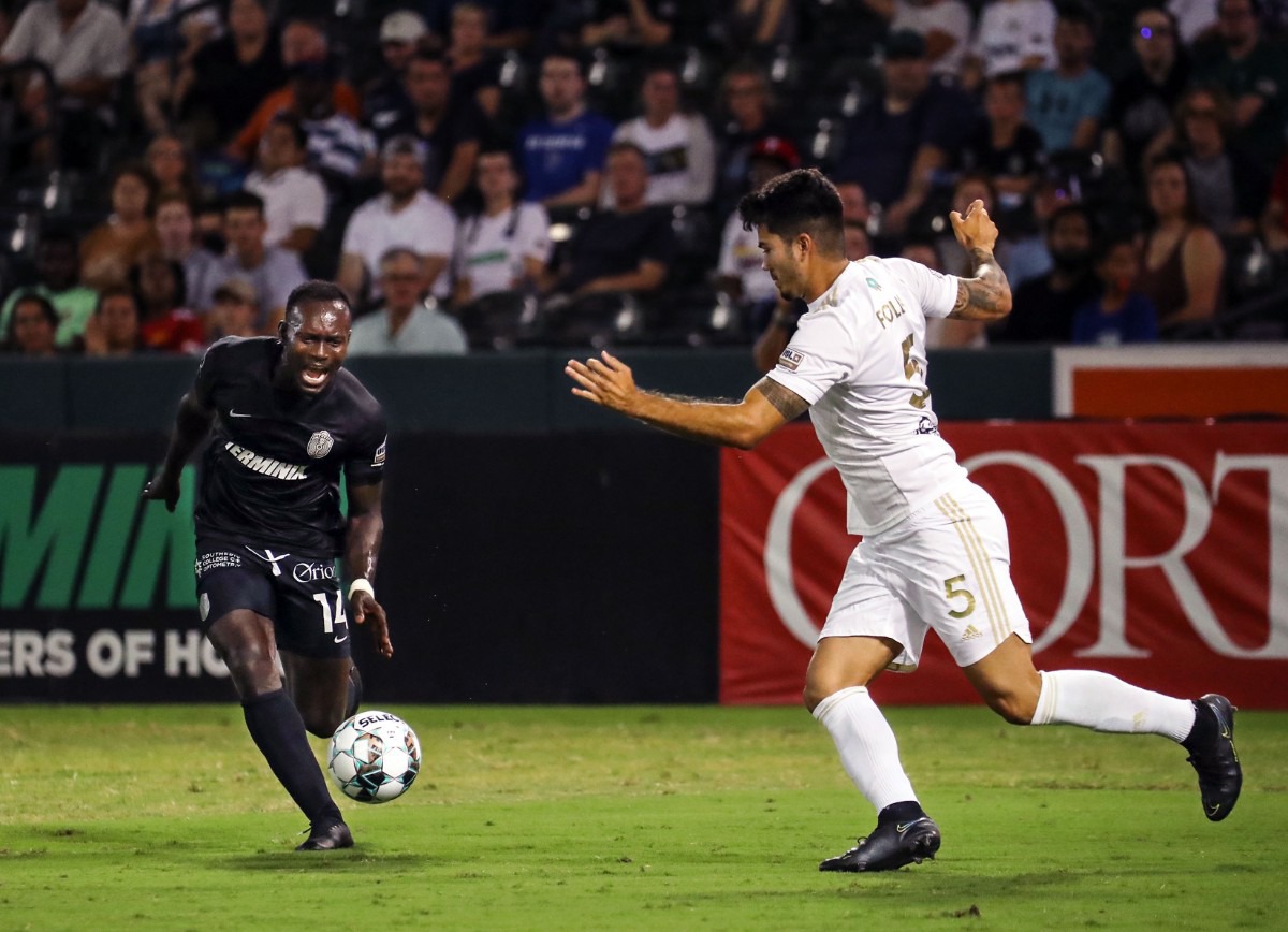 <strong>Memphis 901 FC forward Francis Atuahene (14) rushes to the ball during a July 24, 2021 match against FC Tulsa at AutoZone Park.</strong> (Patrick Lantrip/Daily Memphian)