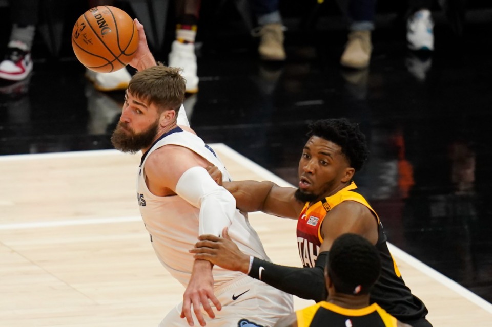 <strong>Utah Jazz guard Donovan Mitchell, right, guards Memphis Grizzlies center Jonas Valanciunas, left, during the first half of Game 2 of their NBA basketball first-round playoff series Wednesday, May 26, 2021, in Salt Lake City.</strong> (Rick Bowmer/AP)