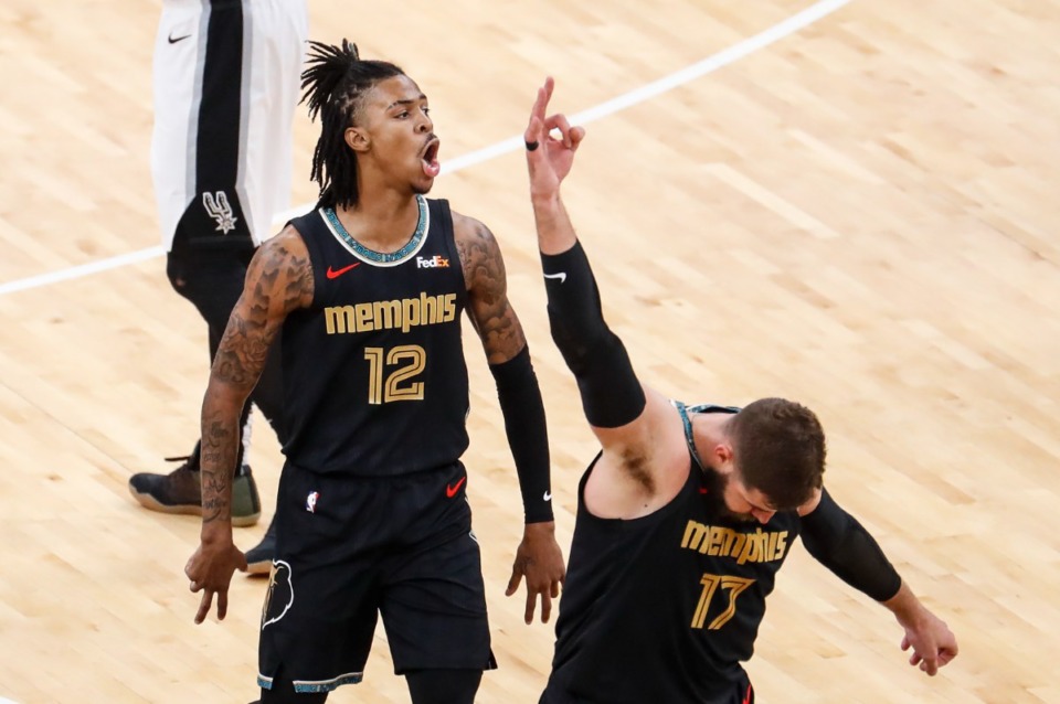 <strong>Memphis Grizzlies center Jonas Valanciunas (bottom) celebrates teammate Ja Morant&rsquo;s made 3-pointer during action against the San Antonio Spurs on Wednesday, May 19, 2021.</strong> (Mark Weber/The Daily Memphian)