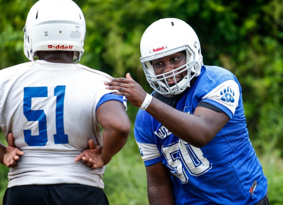 <strong>Overton High School defensive lineman George Thomas III (right) runs through drills during practice on Monday, July 26, 2021</strong>. (Mark Weber/The Daily Memphian)