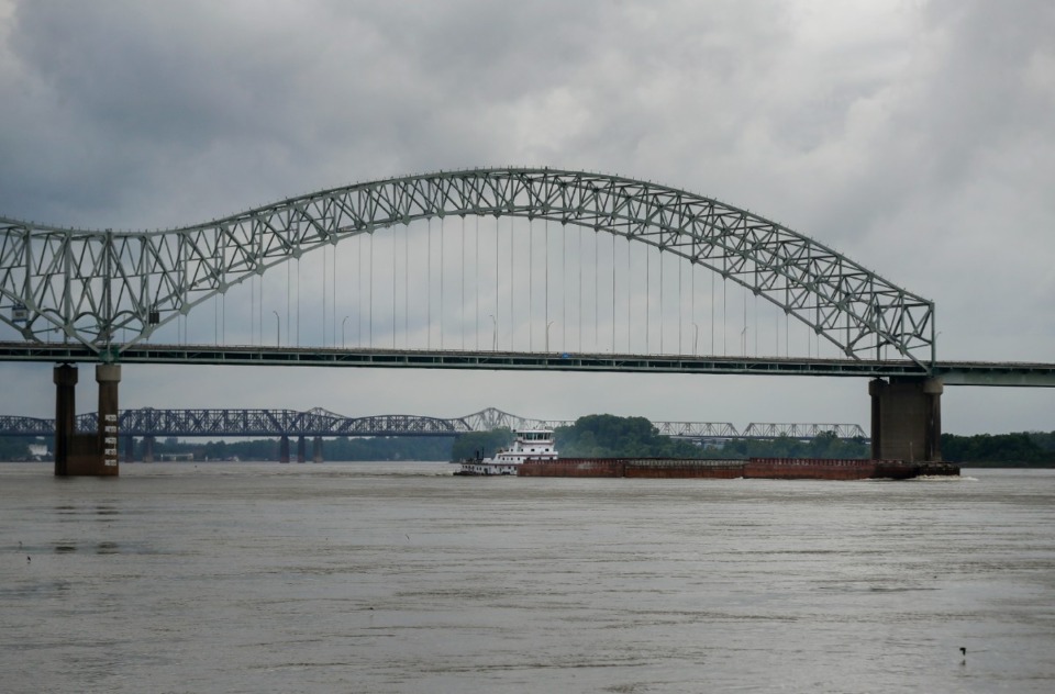 <strong>A barge motors up the Mississippi River under the closed Hernando DeSoto Bridge on Monday, May 17, 2021.</strong> (Mark Weber/The Daily Memphian)