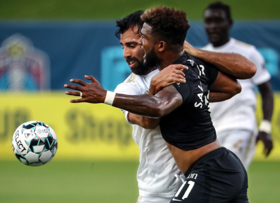 <strong>Memphis 901 FC forward Michael Salazar (11) fights off a defender during a July 24, 2021 match against FC Tulsa at AutoZone Park.</strong> (Patrick Lantrip/Daily Memphian)