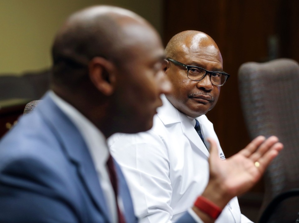 <strong>Shelby County Mayor Lee Harris (left, shown with Dr. Bruce Randolph at a July 15 briefing addressing the surge of Delta variant cases) says his office is weighing weekly COVID testing for county employees.</strong> (Patrick Lantrip/Daily Memphian)