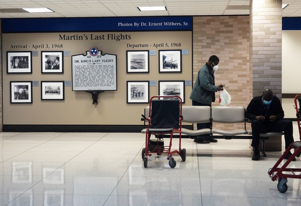 <strong>This photo exhibit installed with a $50,000 city grant at Memphis International Airport misidentifies the woman walking beside Dr. Martin Luther King Jr. on his final trip to Memphis in 1968. She is Adjua Naantaanbuu, an unsung activist who picked up King at the airport on April 3, 1968, and drove him to a strategy meeting.</strong> (Karen Pulfer Focht / Special to The Daily Memphian)
