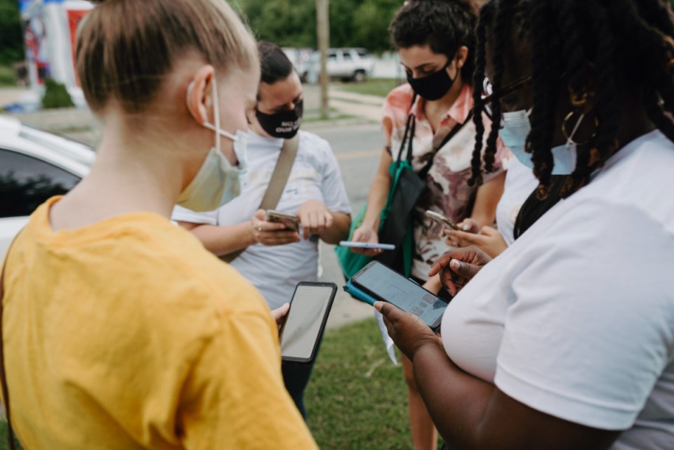 <strong>Volunteers plan their routes for a&nbsp; COVID-19 vaccine literature drop on Saturday, July 17, in Memphis.</strong> (Lucy Garrett/Special to the Daily Memphian)