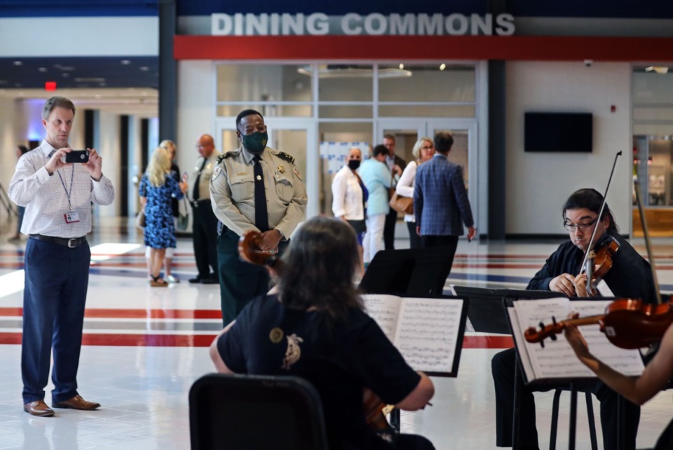 <strong>Shelby County Sheriff Floyd Bonner listens to the Bartlett High School faculty string quartet play during an open house at the renovated school on Thursday, Aug. 5.</strong> (Patrick Lantrip/Daily Memphian)