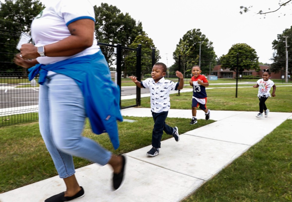 <strong>Porter-Leath Early Childhood Academy students (left to right) Marlen W., Ethan H. and Rayne H. run around the playground on Tuesday, July 13, 2021 in Frayser.</strong> (Mark Weber/The Daily Memphian)