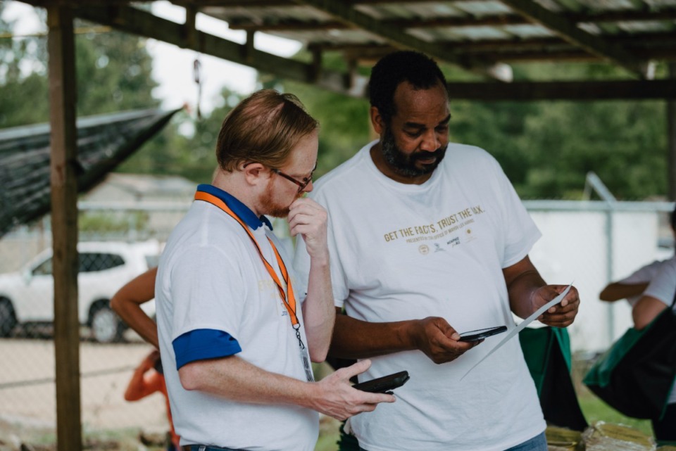 <strong>Volunteers plan their routes for the COVID-19 vaccine literature drop on Saturday, July 17, 2021</strong>. (Lucy Garrett/Special to the Daily Memphian)