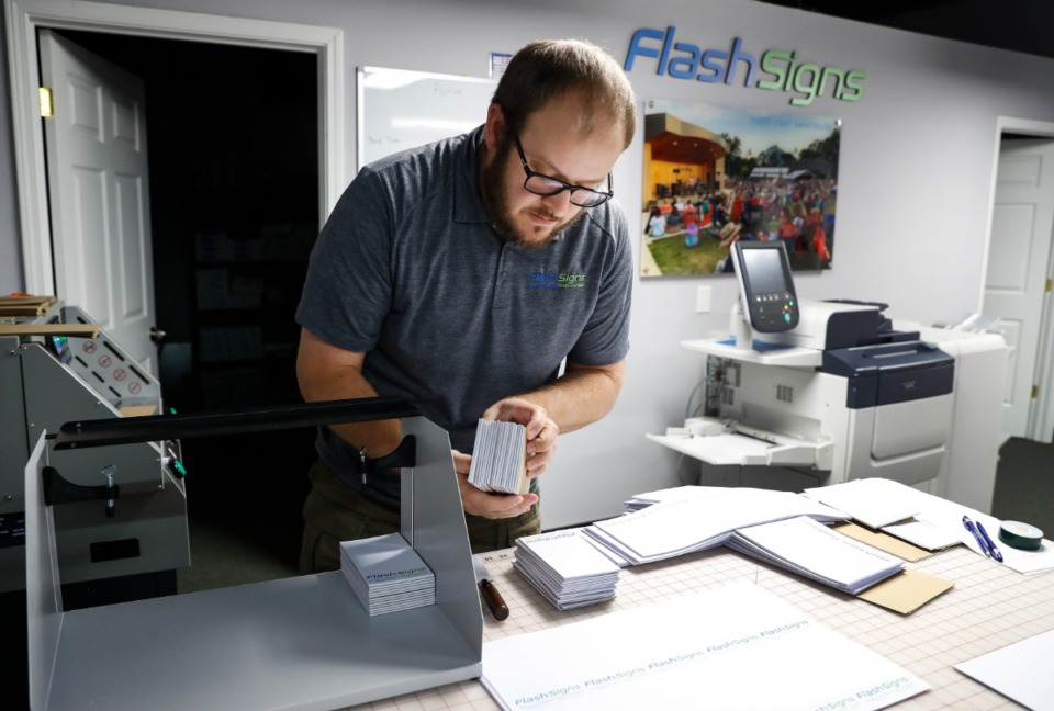 <strong>Zach Zuber makes notepads at Flash Signs in Arlington on Tuesday, August 10, 2021.</strong> (Mark Weber/The Daily Memphian)