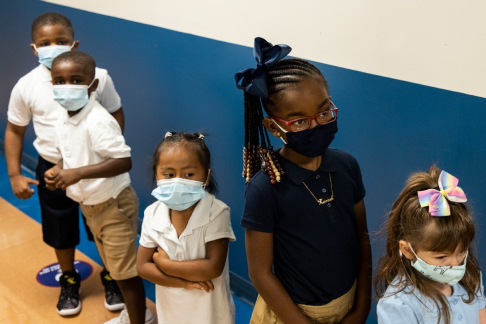 <strong>Students line up Monday, Aug. 9 in the hallway at Bruce Elementary during Shelby County Schools' first day of school for the 2021-2022 school year.</strong> (Brad Vest/Special to The Daily Memphian)