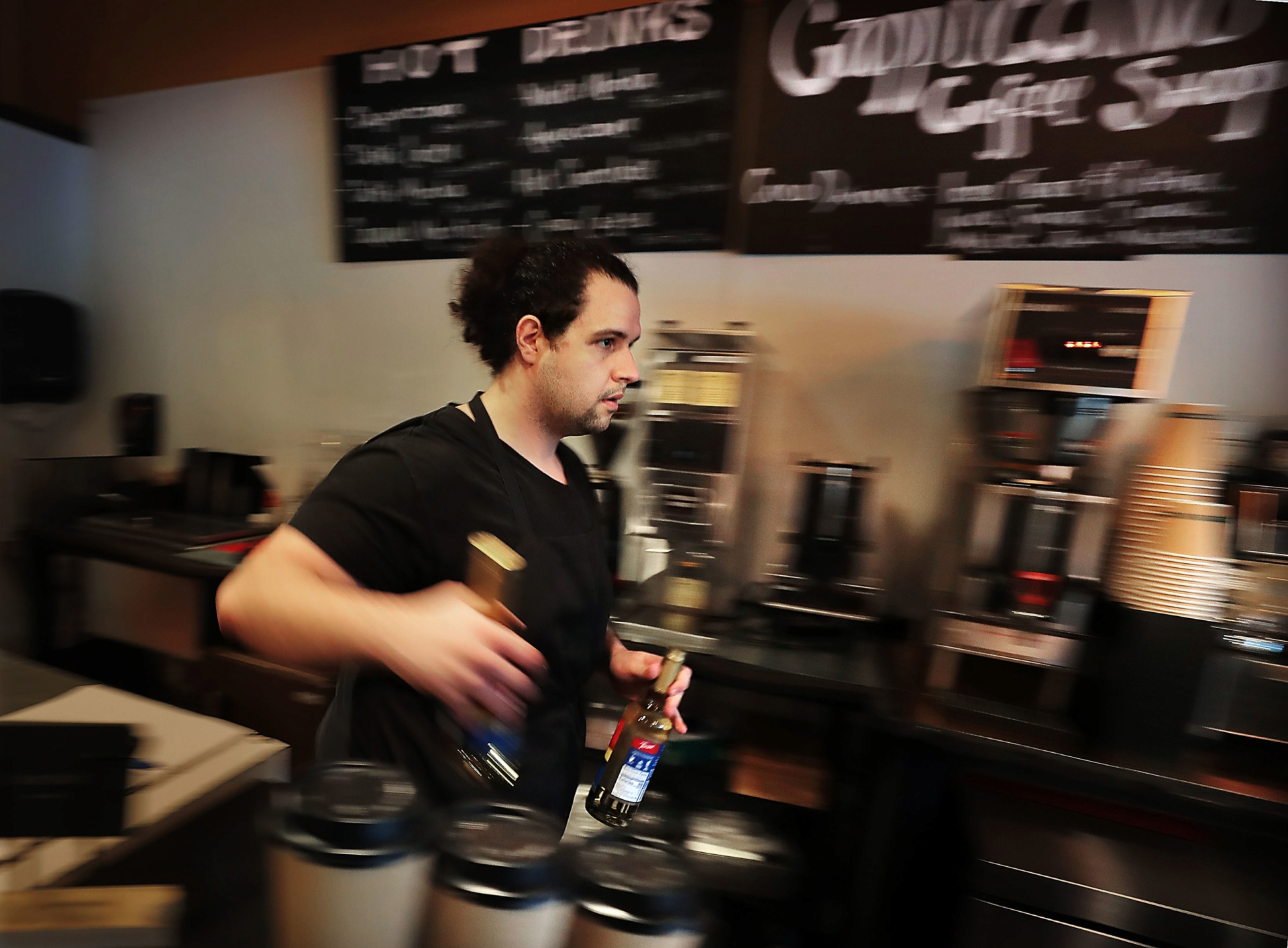 <strong>Barista Zach Rhadfi stocks up the bar at Cappuccino coffee shop in Germantown on Wednesday, Feb. 6. Cappuccino's new owner, Rick Brenneman, is trying to take his newly acquired business in a different direction.&nbsp;In early January, he reached out through Facebook, and asked the community how he could improve the shop. More than 250 responses came in, ranging from changing the menu to changing the interior.&nbsp;</strong>(Jim Weber/Daily Memphian)