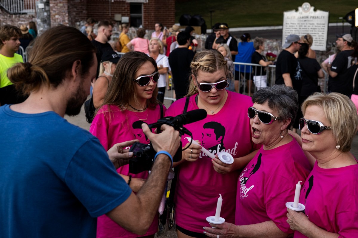 <strong>Fans gather along Elvis Presley Boulevard during the Elvis Week 2021 Candlelight Vigil.</strong> (Brad Vest/Special to The Daily Memphian)