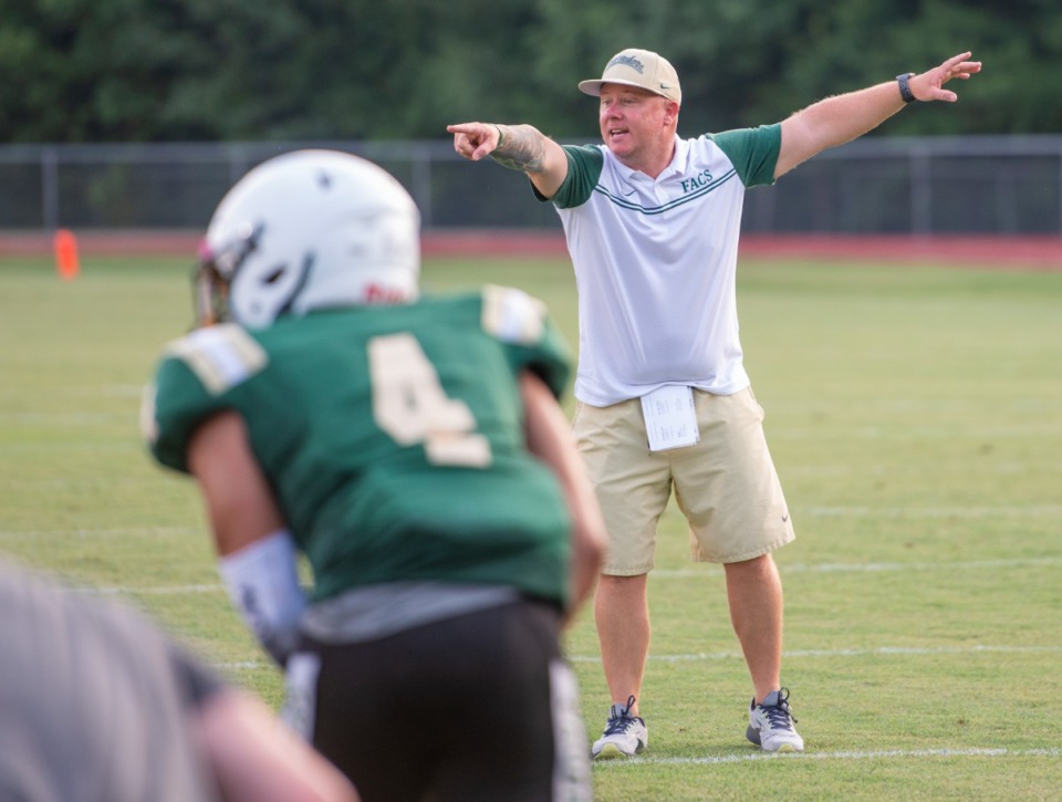 <strong>First year head coach, Mitch McDaniel, leads his young FACS football team through scrimmages with Rossville Academy at FACS Thursday, July 29, 2021.</strong> (Greg Campbell/Special to The Daily Memphian)