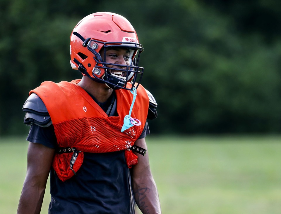 <strong>Ridgeway running back Quinterrious Ayers laughs with his teammates at a July 27, 2021 practice. Following the latest round of TSSAA re-classification, 17 teams &mdash; including Ridgeway &mdash; will be playing in new regions this fall.</strong> (Patrick Lantrip/Daily Memphian)