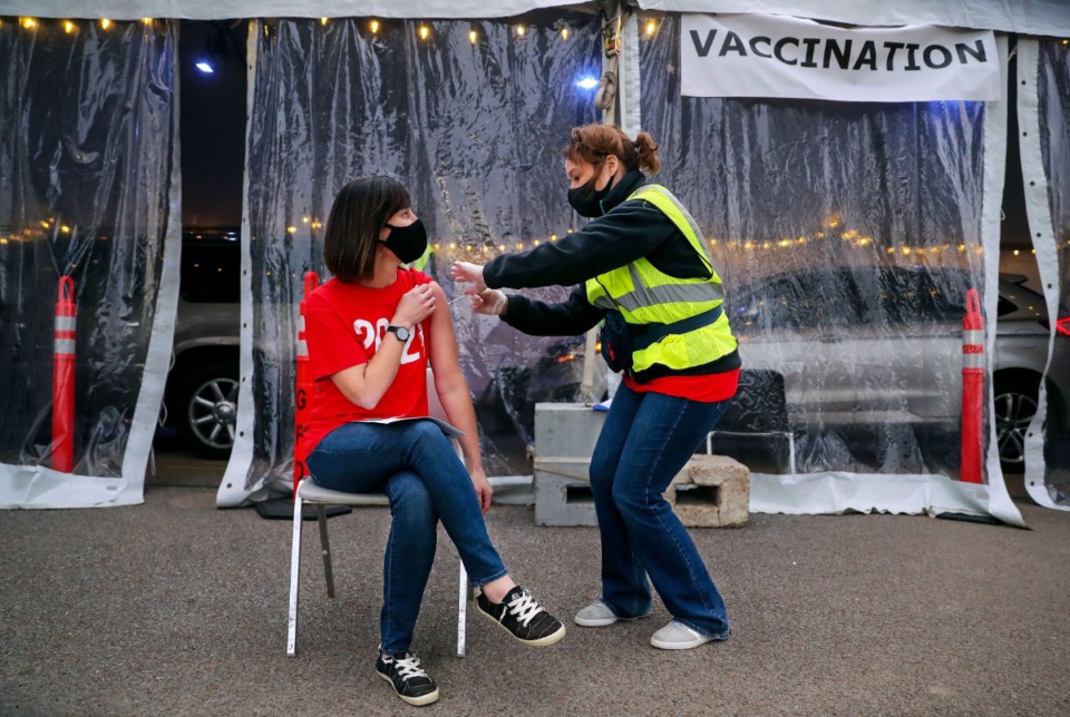 <strong>Elissa Stratton, executive director of HR for Germantown Schools, receives a vaccine from registered nurse Alison Herrington at Germantown Baptist Church March 5, 2021.</strong> (Patrick Lantrip/Daily Memphian file)