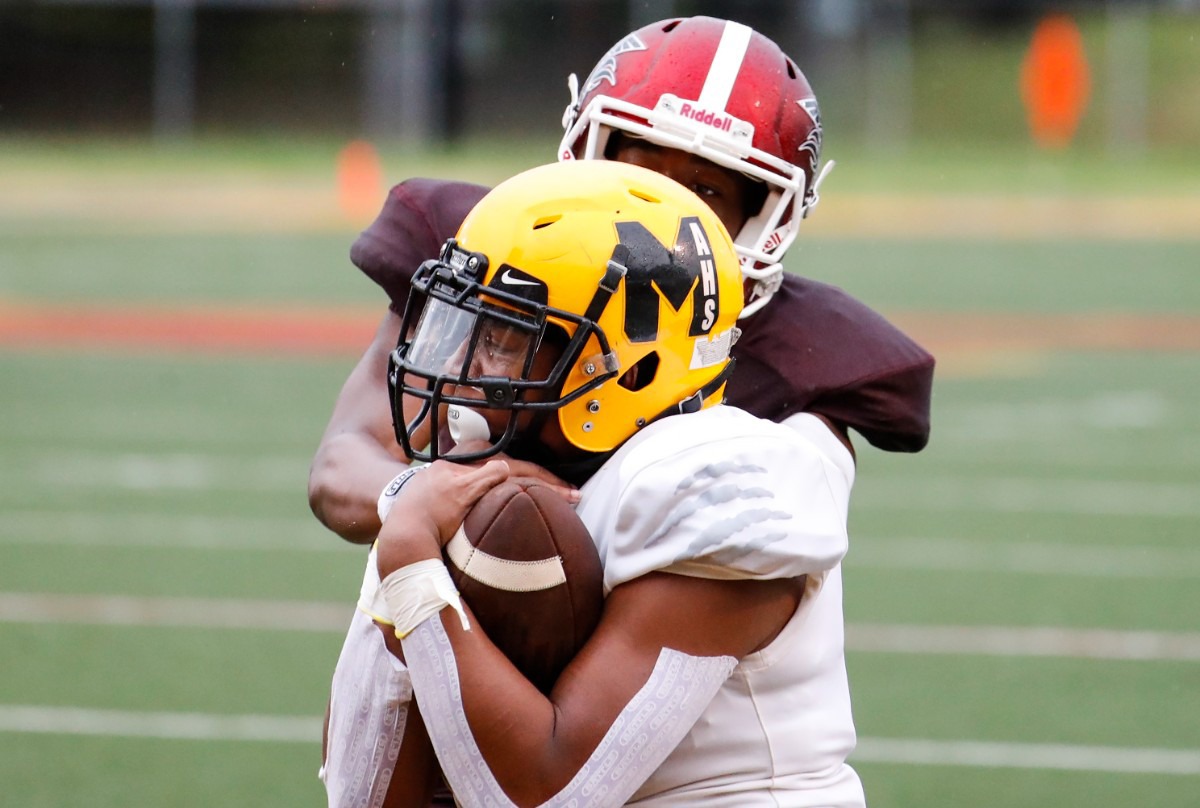 <strong>MAHS receiver Cameron Miller (front) makes a reception for a TD against MASE on Thursday, Aug. 19, 2021.</strong> (Mark Weber/The Daily Memphian)