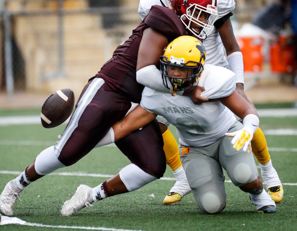 <strong>MAHS&rsquo; Terrique Hogue (right) reaches for an MASE fumble on Thursday, Augu.19, 2021.</strong> (Mark Weber/The Daily Memphian)