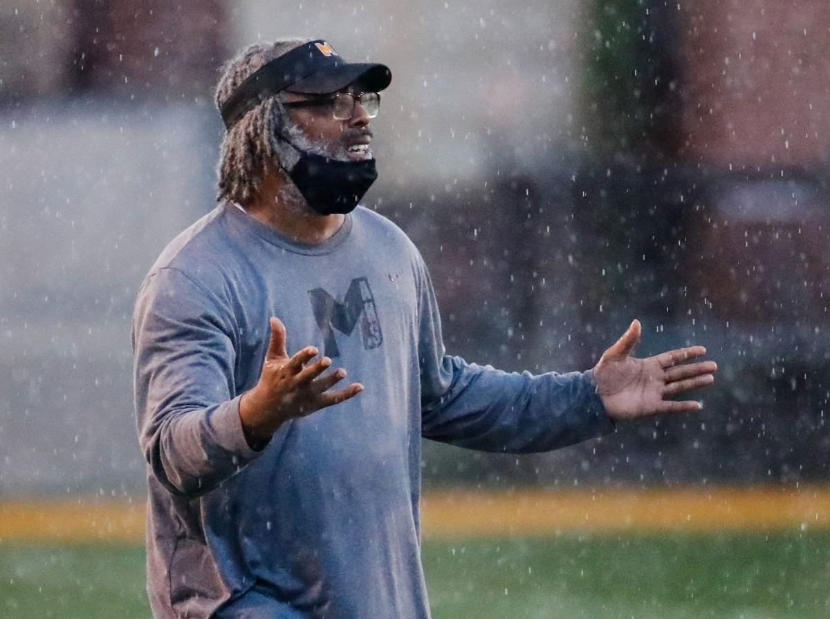 <strong>MAHS coach Cedric Miller shouts instruction in the game against MASE on Thursday, Aug. 19, 2021.</strong> (Mark Weber/The Daily Memphian)