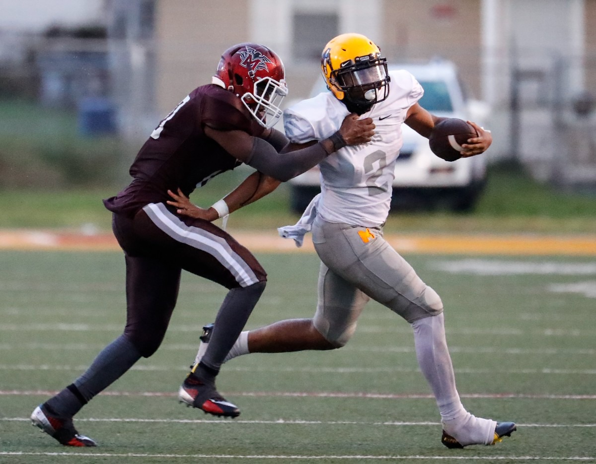 <strong>MAHS receiver Cameron Miller (right) runs against MASE on Thursday, Aug. 19, 2021.</strong> (Mark Weber/The Daily Memphian)