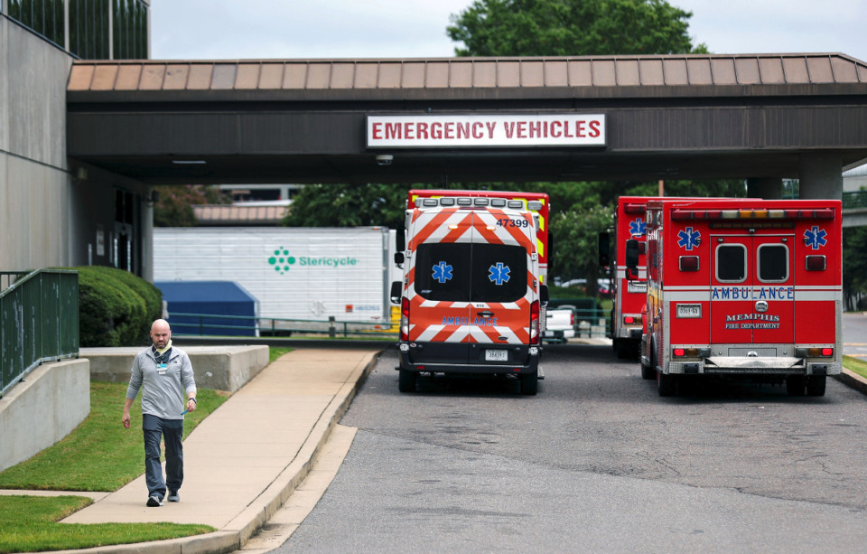 <strong>An employee leaves the emergency room as ambulances line up outside Baptist Memorial Hospital, Aug. 20, 2021.&nbsp;Local nurses and other staff, tired of feeling unappreciated, are leaving in droves. </strong>(Patrick Lantrip/Daily Memphian)