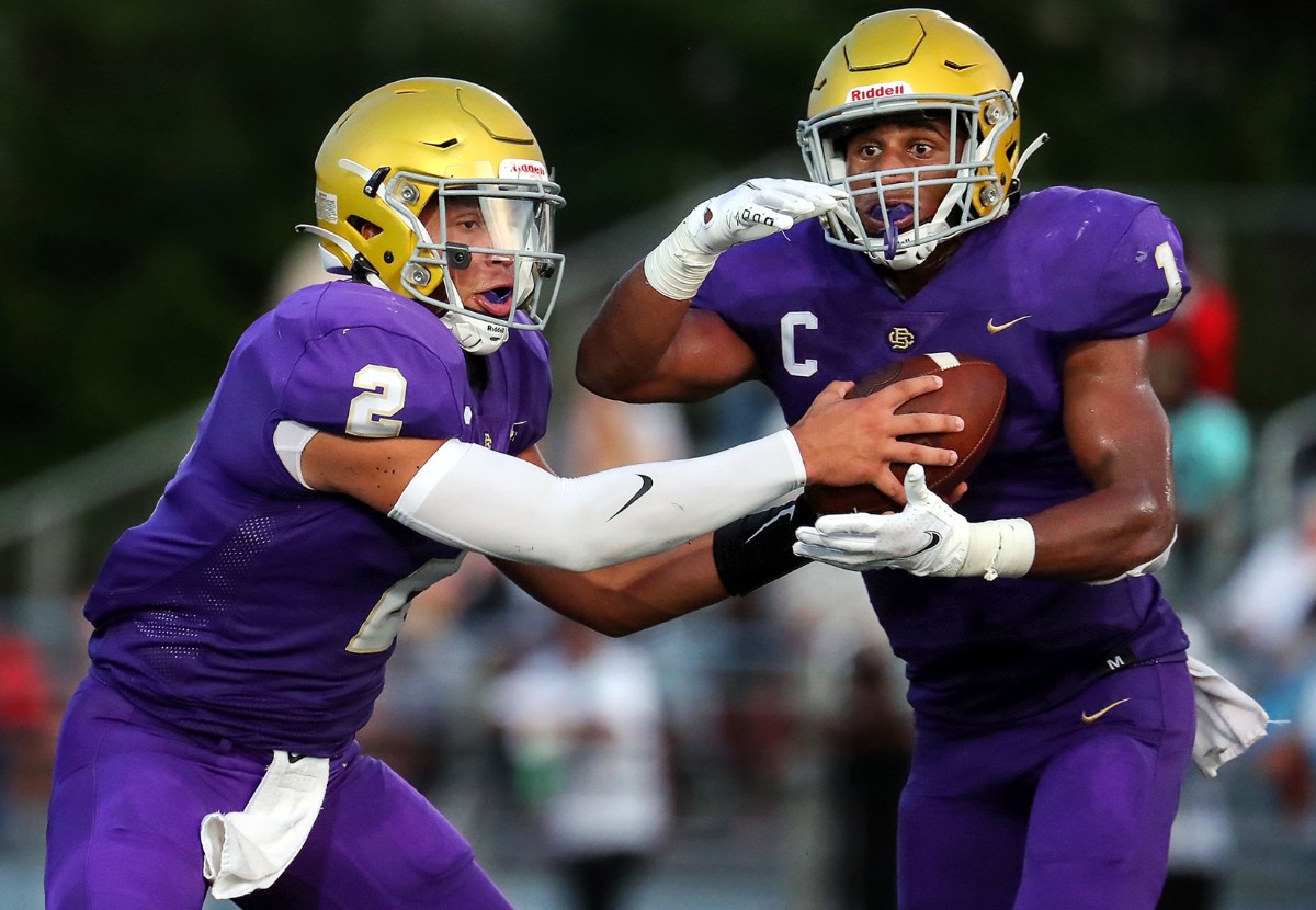 <strong>CBHS quarterback Ashton Strother (2) hands the ball off to running back Dallan Hayden (1) during an Aug. 21 game against Germantown.</strong> (Patrick Lantrip/Daily Memphian)