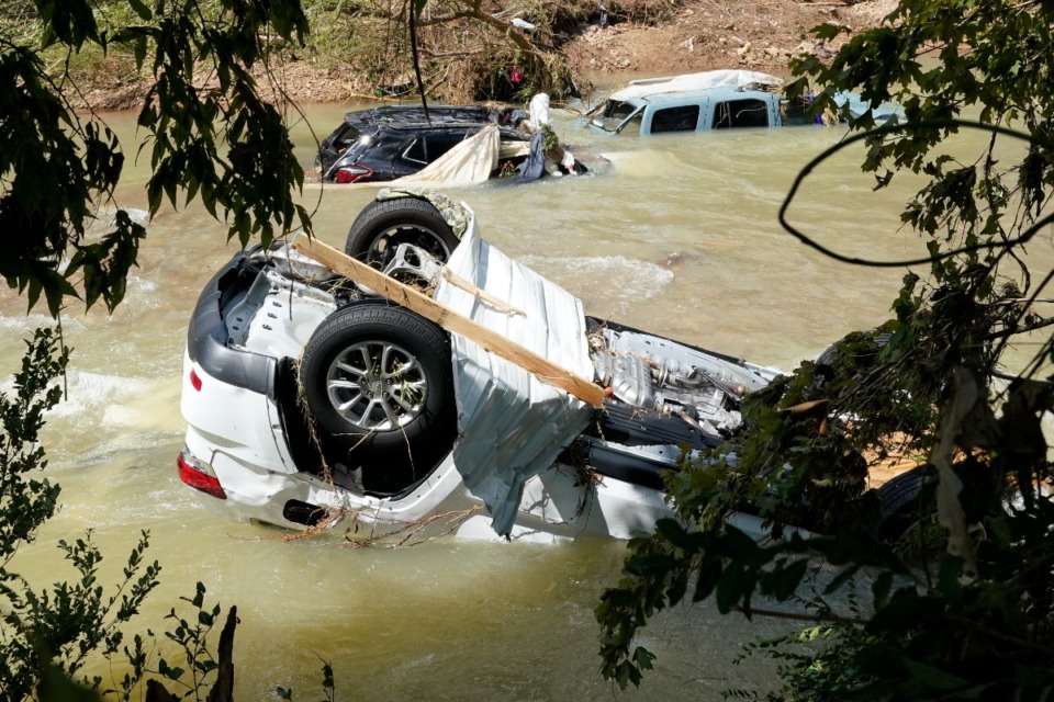 <strong>Vehicles come to rest in a stream Sunday, Aug. 22, 2021, in Waverly, Tenn. Heavy rains caused flooding Saturday in Middle Tennessee and have resulted in multiple deaths as homes and rural roads were washed away.</strong> (Mark Humphrey/AP)
