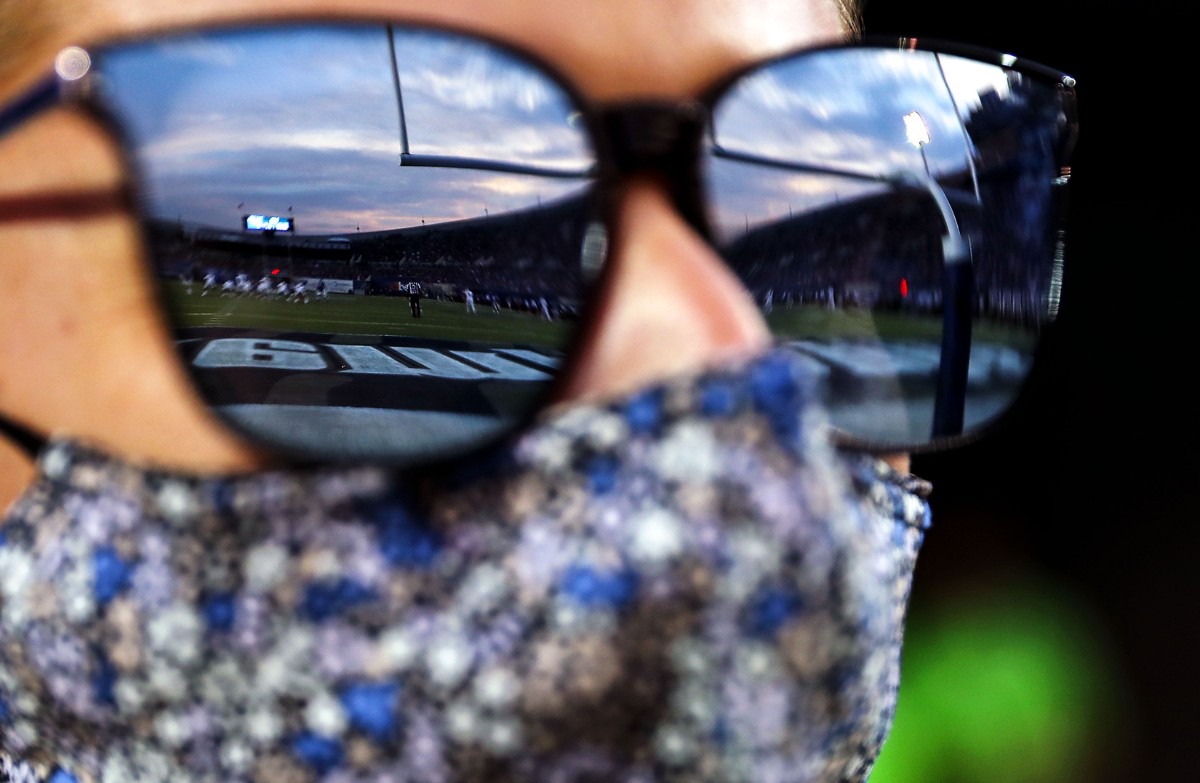 <strong>The sun sets over Liberty Bowl Memorial Stadium as Jenny Pallme watches the University of Memphis play Nicholls State on Saturday, Sept. 4, 2021.</strong> (Patrick Lantrip/Daily Memphian)
