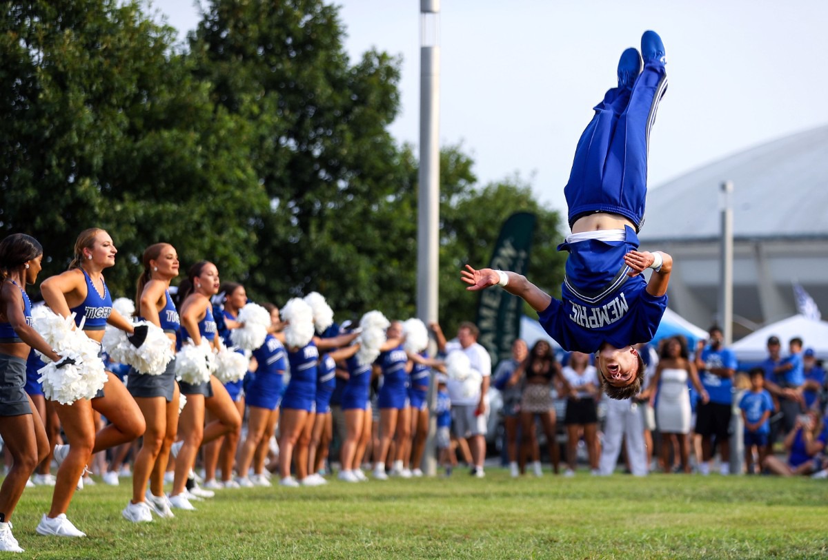 <strong>University of Memphis cheerleaders pump up the crowd on the Tiger Lane Saturday afternoon before the game.</strong> (Patrick Lantrip/Daily Memphian)