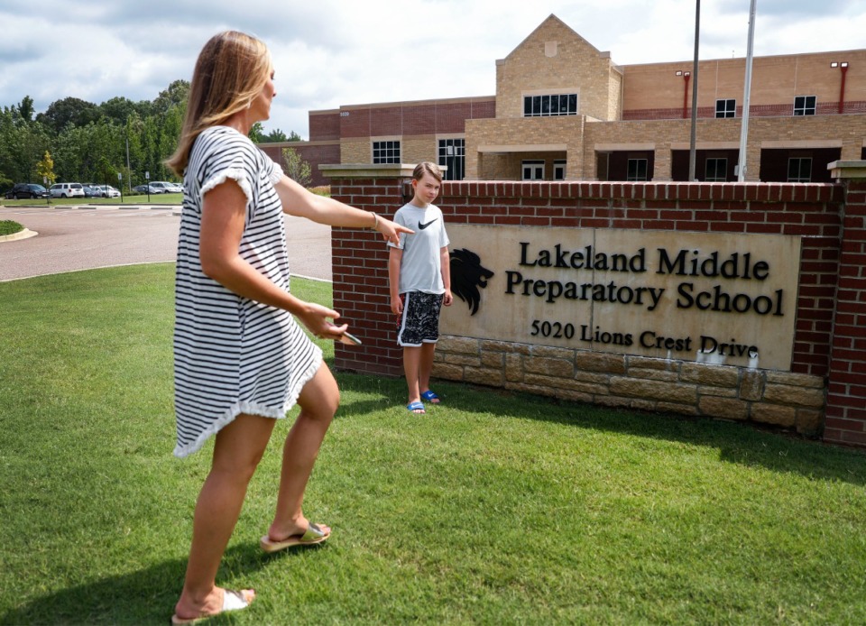<strong>Lakeland Preparatory School parent Tiffany Maclin (left) points to a spot in front of the school sign for her son Tanner to stand as they recreate his first day of school picture on Thursday, July 30, 2020.</strong> (Mark Weber/Daily Memphian file)