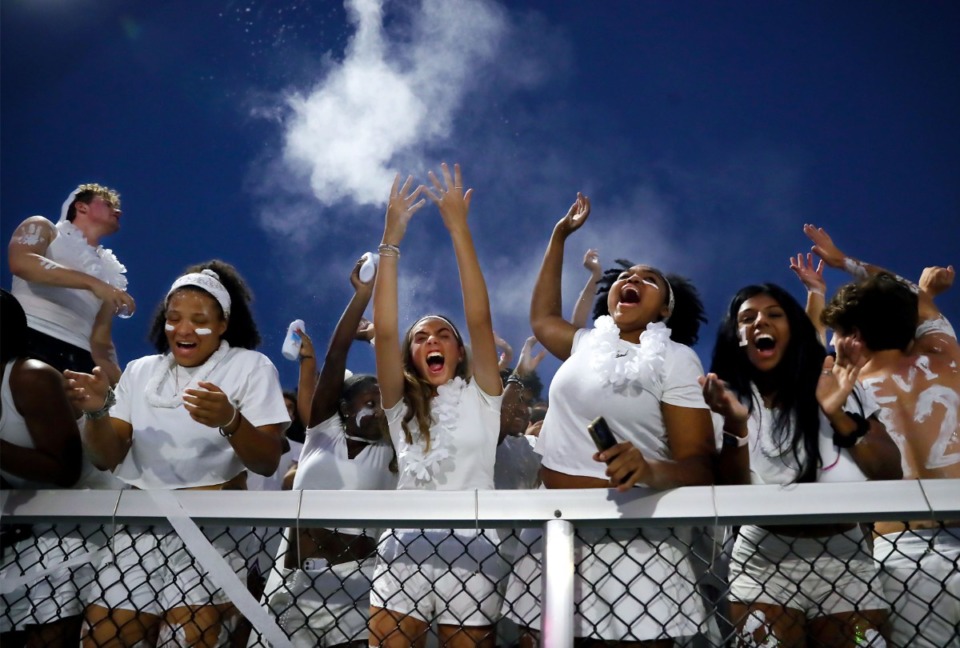 <strong>The Lausanne student section throws baby powder into the air after a touchdown on Sept. 10, 2021, at Bartlett High School.</strong> (Patrick Lantrip/Daily Memphian)