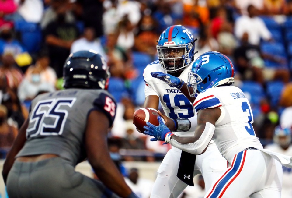 <strong>Tennessee State quarterback Geremy Hickbottom (19) hands the ball off during the Southern Heritage Classic in Memphis, Tennessee Sept. 11, 2021.</strong> (Patrick Lantrip/Daily Memphian)