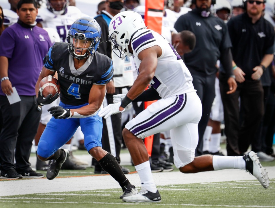 <strong>Memphis receiver Calvin Austin III (left) makes a first down catch on Nov. 21, 2020.&nbsp;Austin&rsquo;s 239 receiving yards against Arkansas State were the second-most receiving yards in a game by a Memphis receiver behind only Anthony Miller&rsquo;s 250 yards in 2016.&nbsp;</strong> (Mark Weber/The Daily Memphian)
